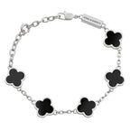 Silver bracelet with black clover-shaped charms on a white background