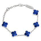 Silver bracelet with blue flower-shaped charms on a white background