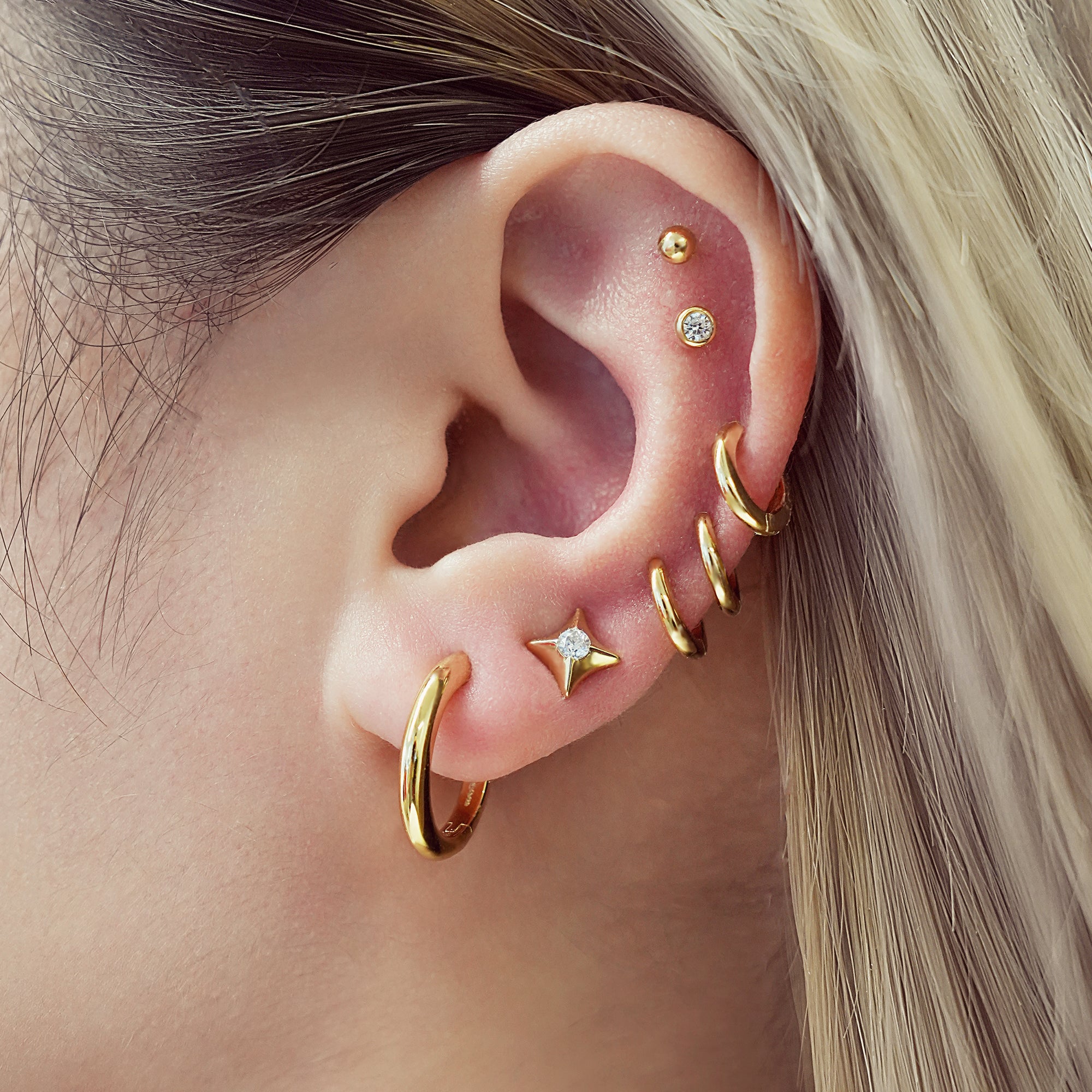GOLD TUBE SMALL HUGGIE HOOP EARRINGS
