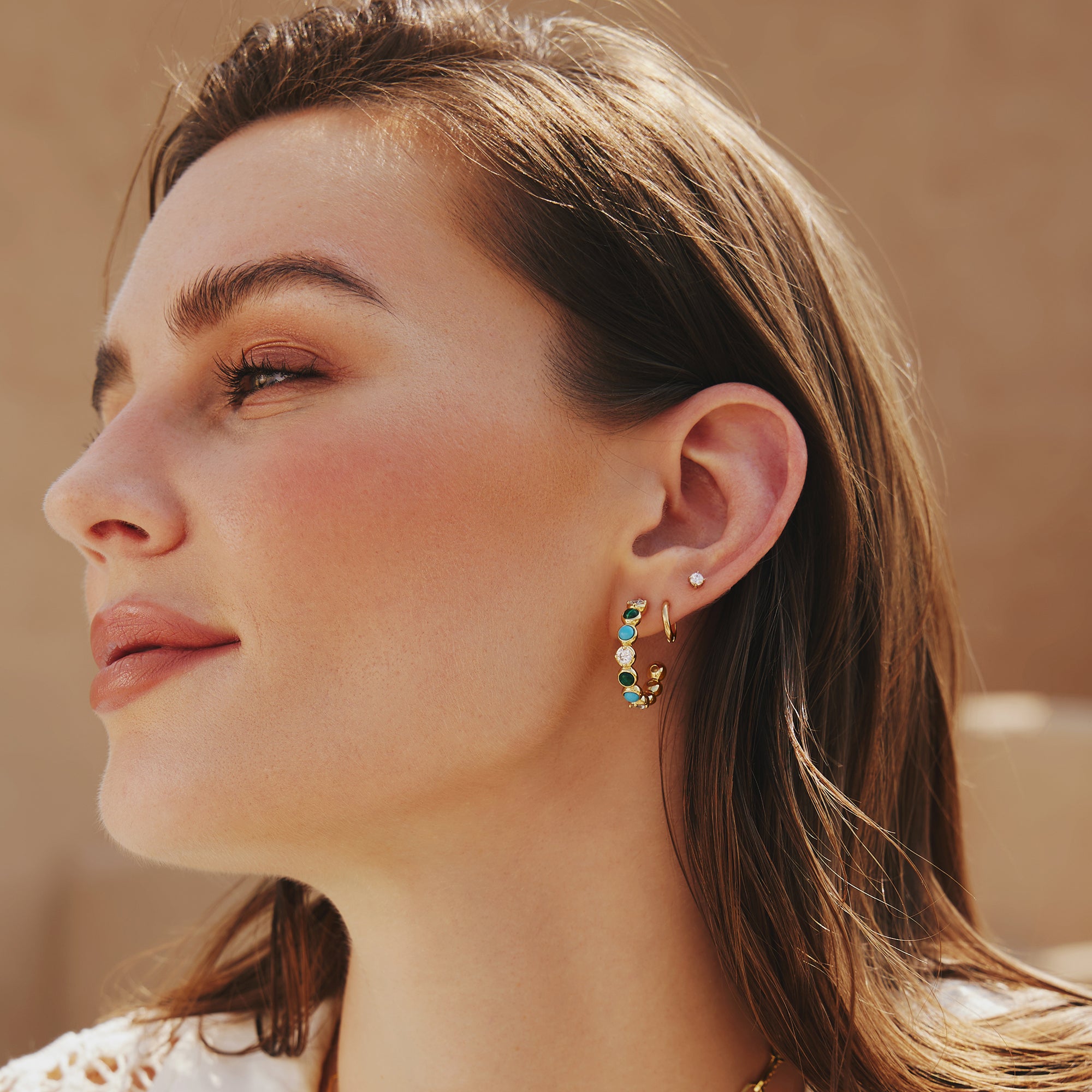 GOLD TUBE SMALL HUGGIE HOOP EARRINGS