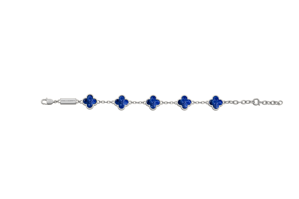 Silver bracelet with blue flower-shaped charms on a white background